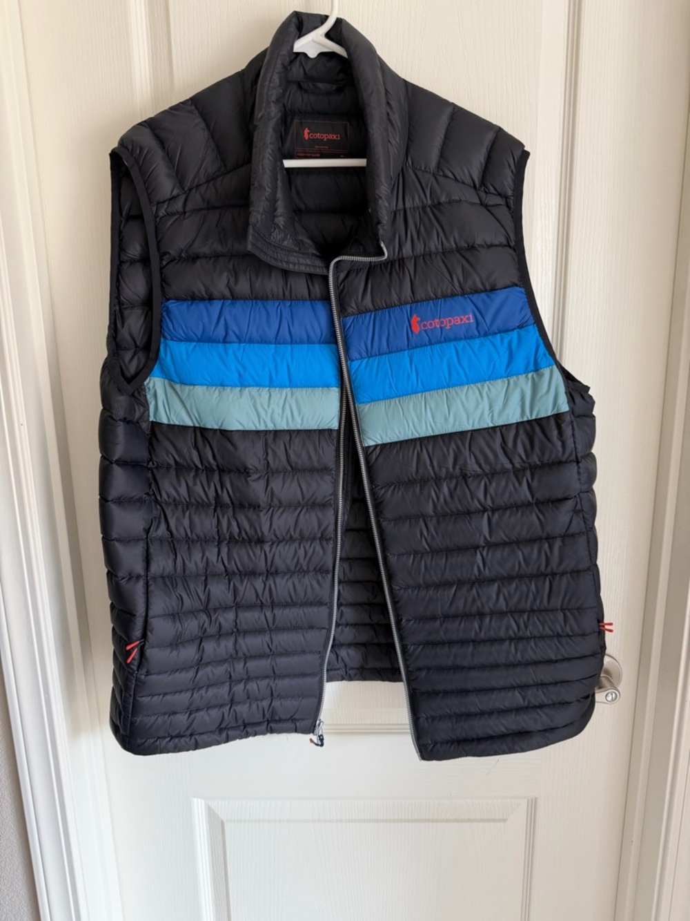 cotopaxi Black Quilted Vest with Blue and Teal Chest Stripes